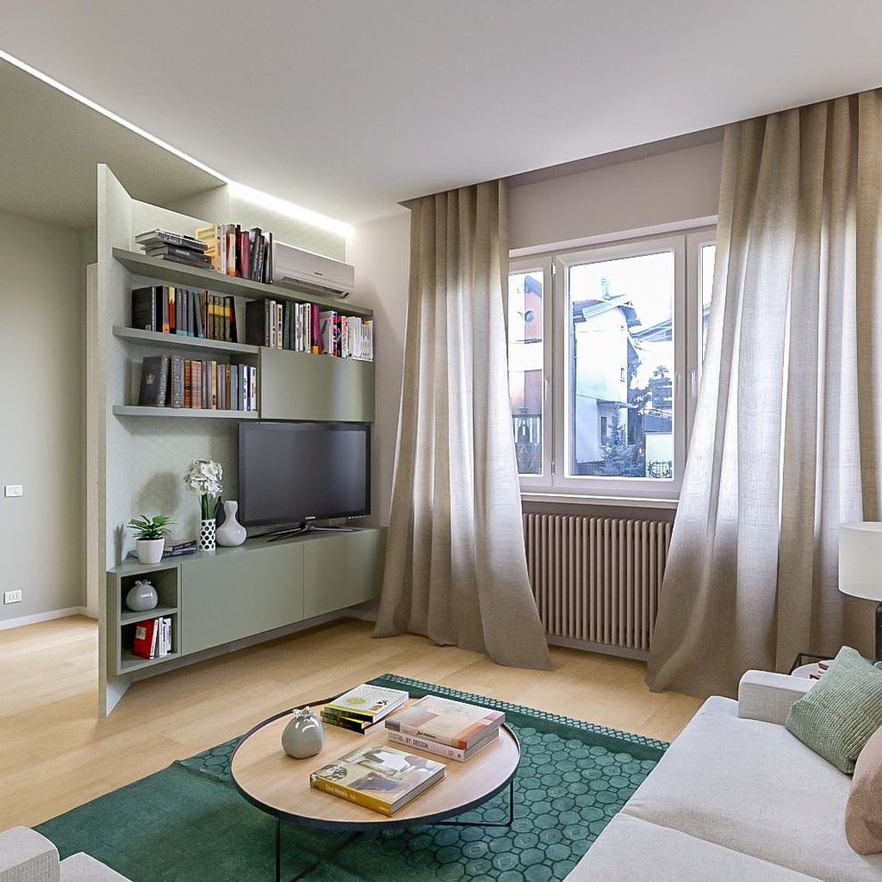 Example of a mid-sized trendy open concept light wood floor living room library design in Milan with beige walls and a media wall