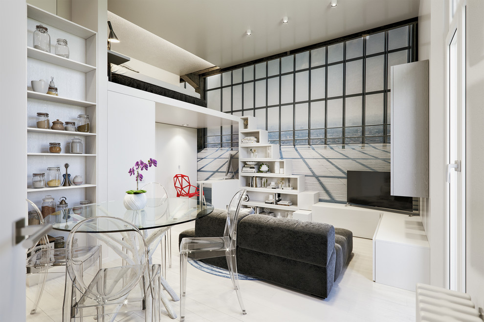 Immagine di un piccolo soggiorno design aperto con libreria, pareti multicolore, pavimento in laminato, pavimento beige e TV autoportante