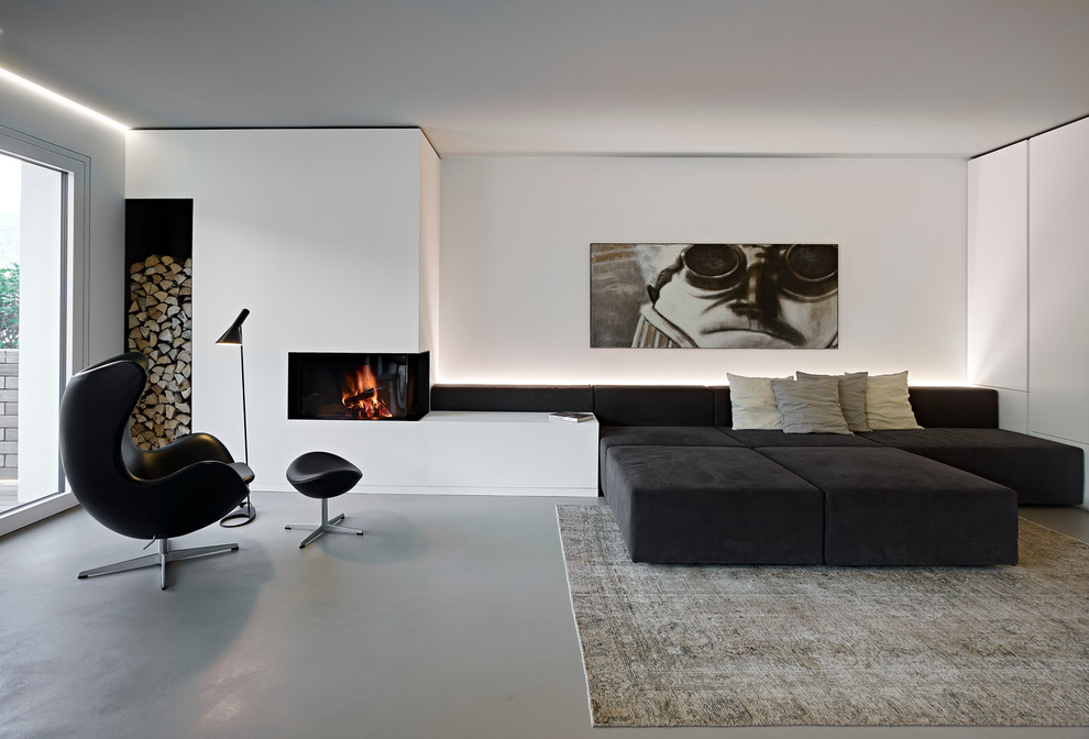 Свежая идея для дизайна: открытая гостиная комната в современном стиле с белыми стенами и угловым камином - отличное фото интерьера