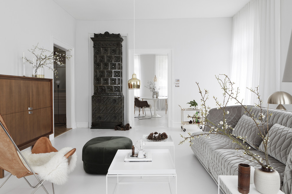 Inspiration for a scandi enclosed living room in Frankfurt with white walls and a tiled fireplace surround.