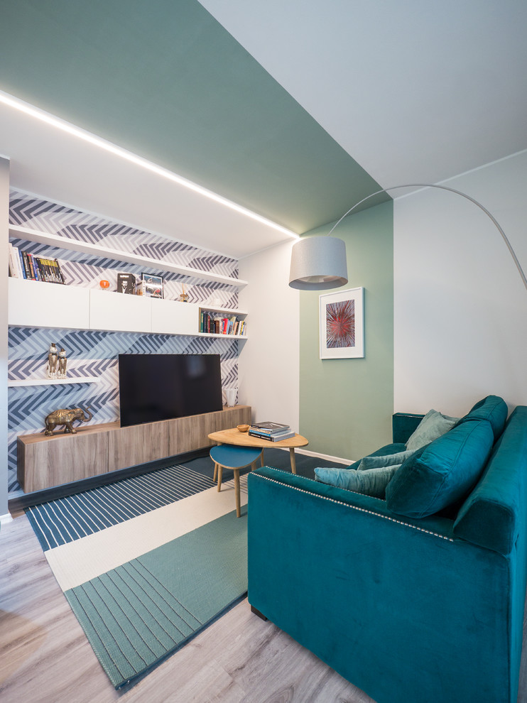 Ispirazione per un soggiorno minimal di medie dimensioni e aperto con pareti verdi, pavimento in linoleum, pavimento grigio e TV autoportante
