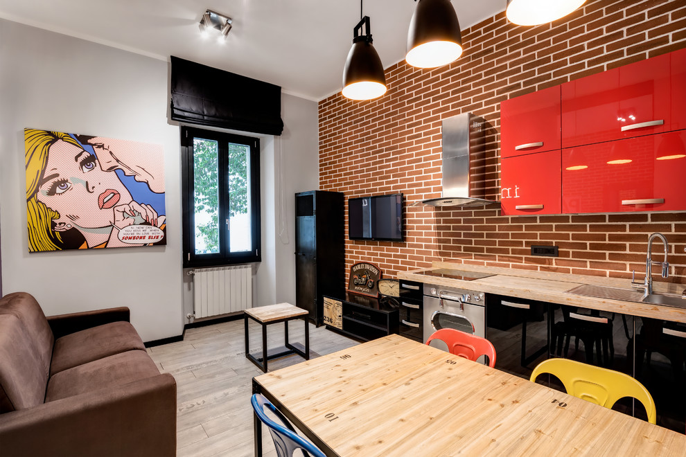 Immagine di un piccolo soggiorno industriale stile loft con pareti grigie e pavimento in gres porcellanato