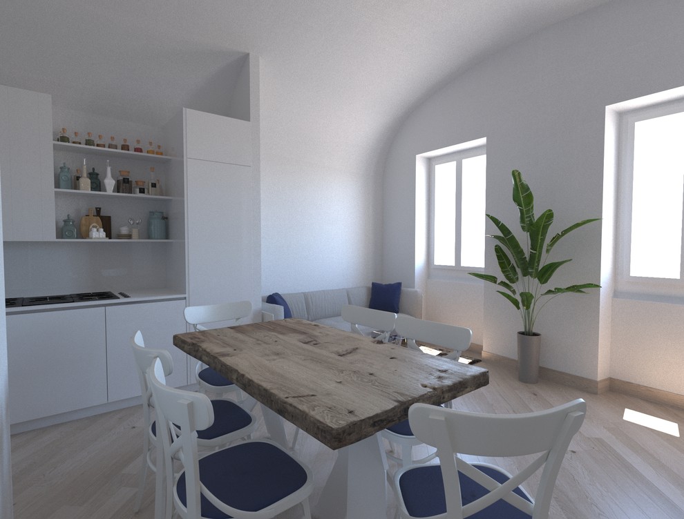 Ejemplo de salón abierto mediterráneo de tamaño medio sin chimenea con paredes blancas, suelo de madera clara, televisor colgado en la pared y suelo beige
