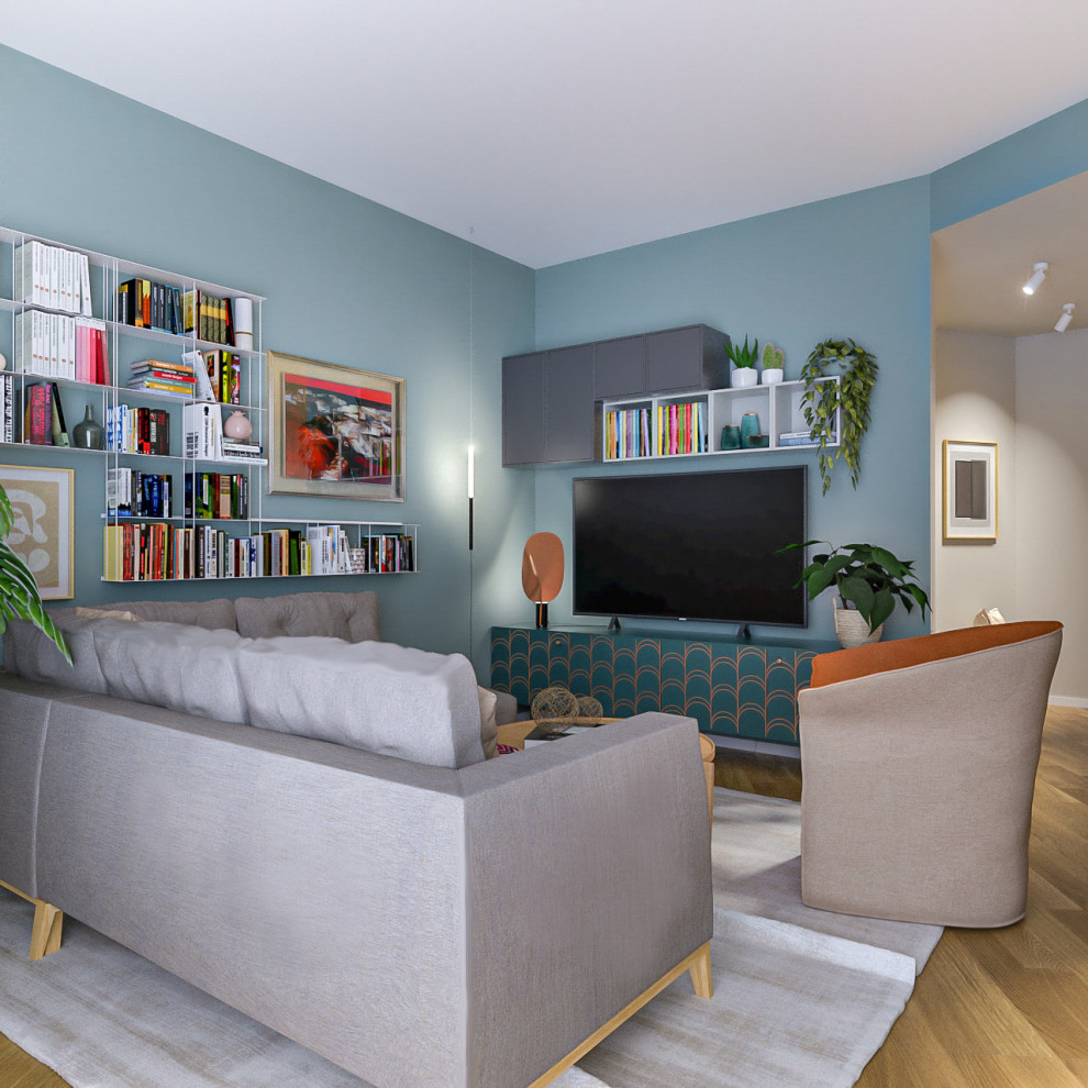 Diseño de biblioteca en casa abierta actual de tamaño medio con paredes azules, suelo de madera clara y televisor independiente