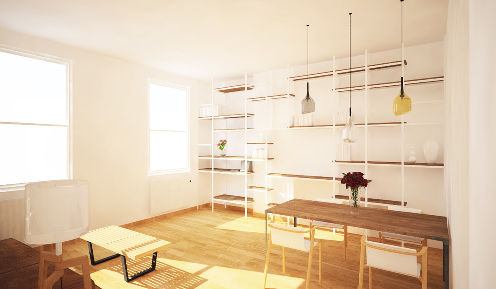 Idee per un soggiorno scandinavo di medie dimensioni e aperto con libreria, pareti beige e pavimento in legno massello medio