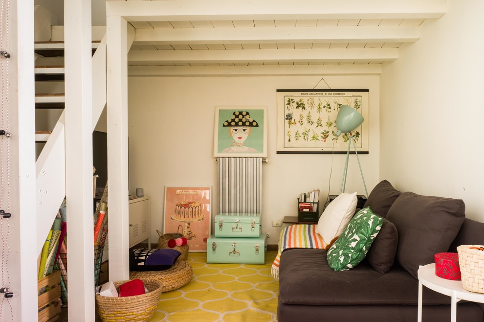 Inspiration for an eclectic open plan games room in Venice with white walls and no fireplace.