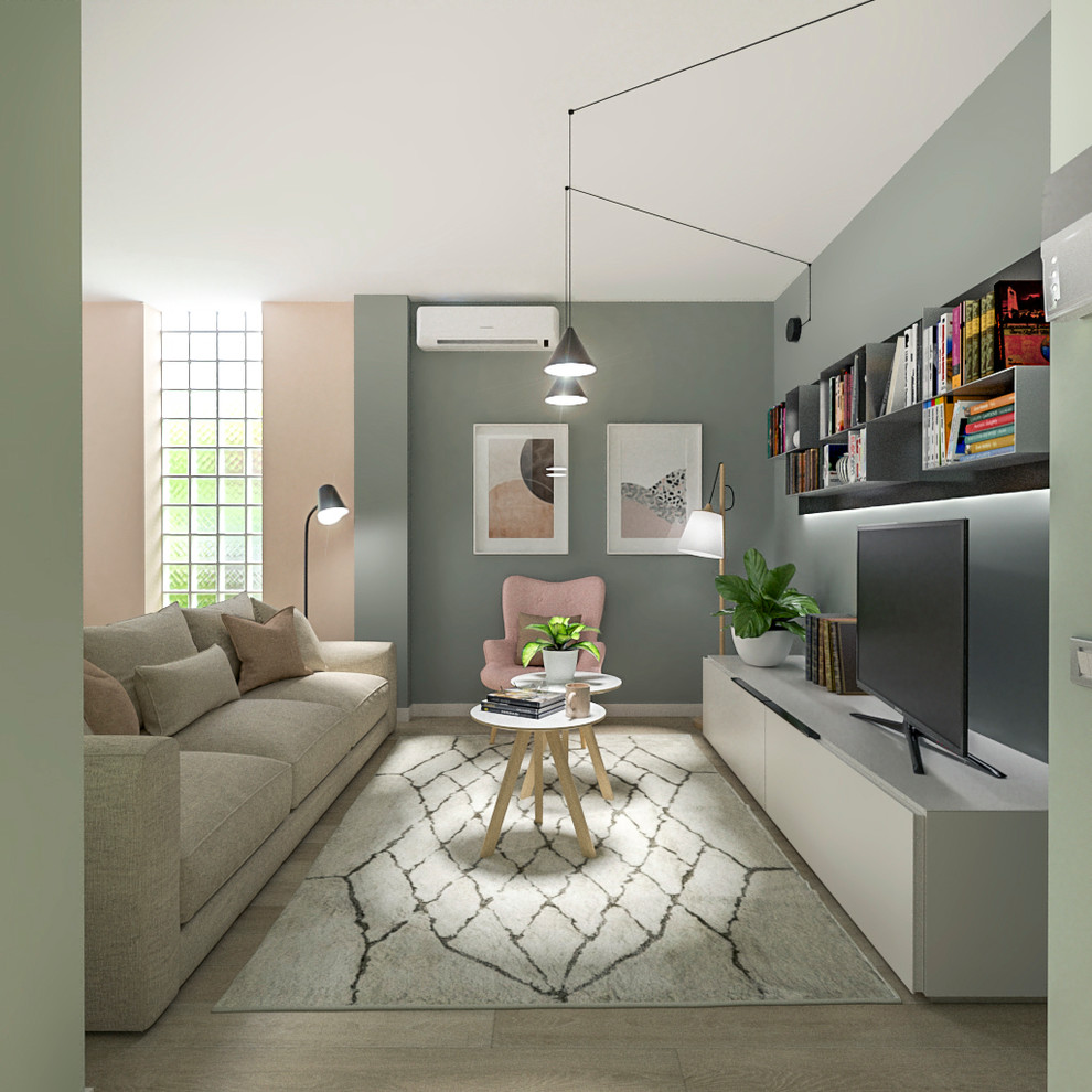 Foto di un soggiorno minimal di medie dimensioni con pareti verdi, parquet chiaro e parete attrezzata