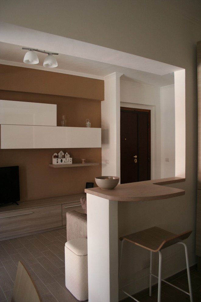 Photo of a small contemporary open plan living room in Rome with porcelain flooring.