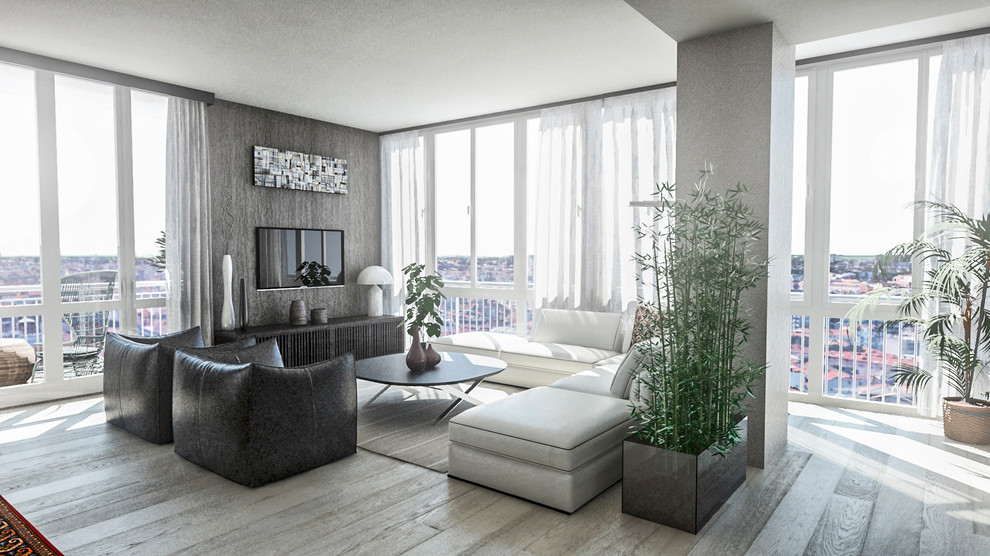 Foto di un grande soggiorno design con libreria, pareti beige, parquet chiaro, TV a parete e pavimento beige