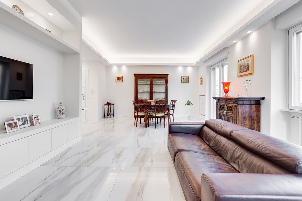 Design ideas for a contemporary open plan games room in Rome with white walls, a wall mounted tv and white floors.