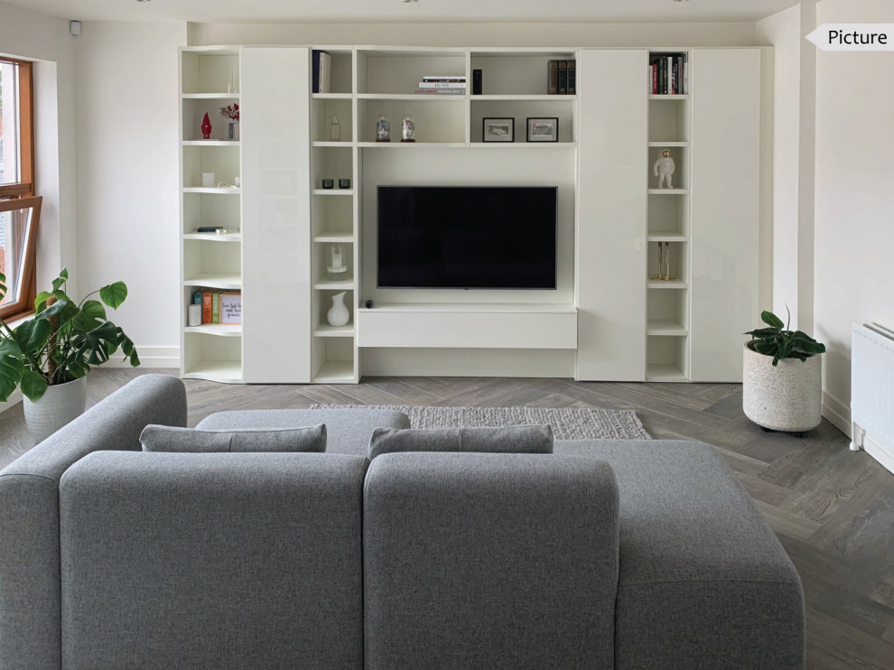 Inspiration for a large modern open plan living room in Belfast with white walls, porcelain flooring, a wall mounted tv, a reading nook, no fireplace and brown floors.