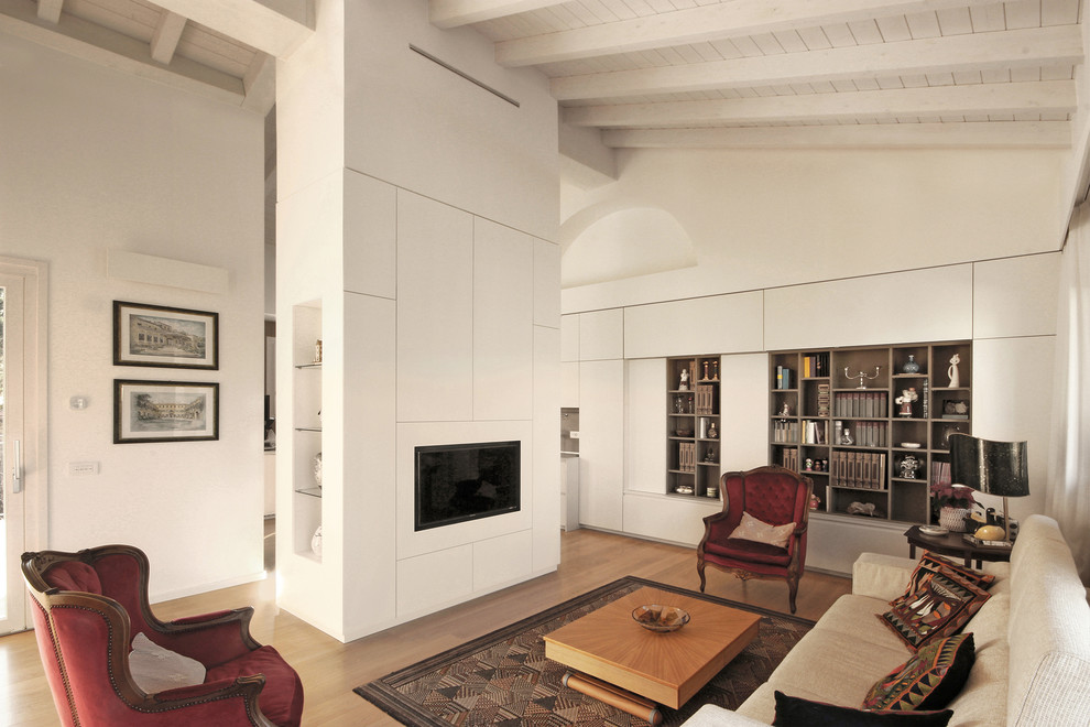 Medium sized contemporary formal open plan living room in Milan with white walls, medium hardwood flooring, a built-in media unit and brown floors.