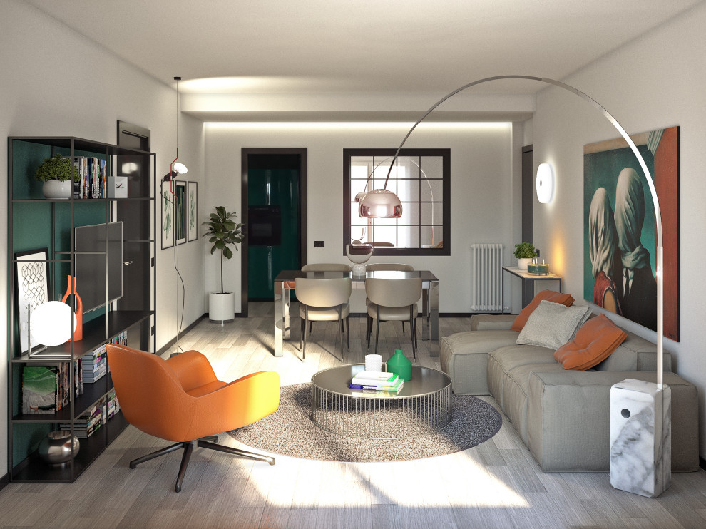 Modelo de salón abierto minimalista de tamaño medio con paredes verdes, suelo laminado, televisor colgado en la pared y suelo gris