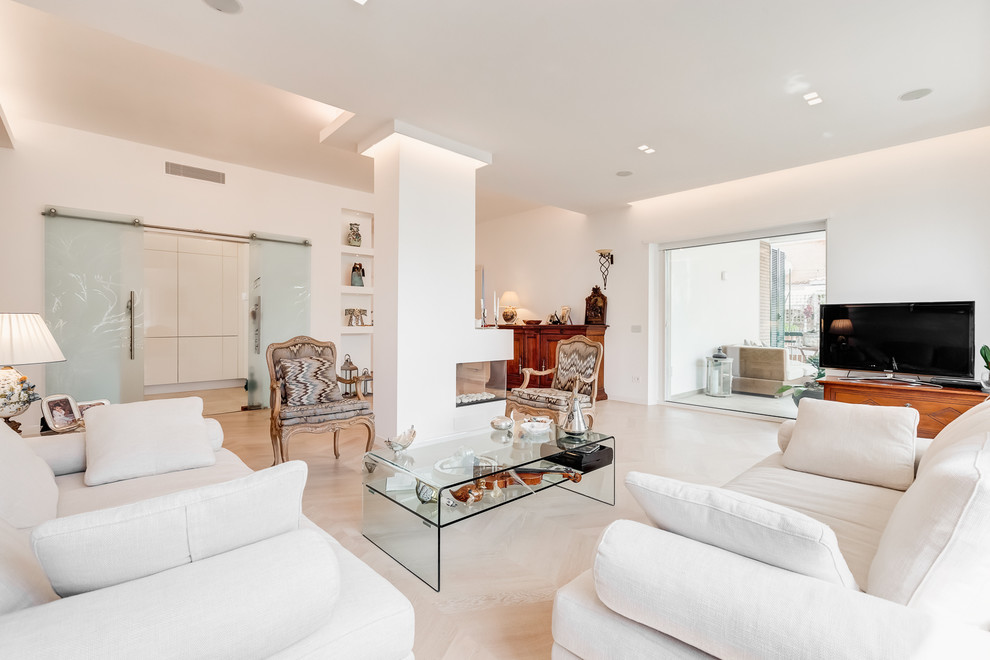 Photo of an expansive contemporary open plan living room in Rome with white walls, light hardwood flooring, a two-sided fireplace, a plastered fireplace surround and beige floors.