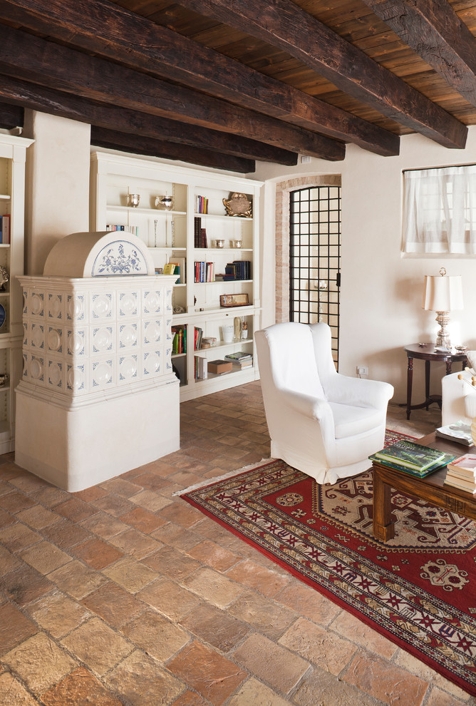 Rural living room in Venice with beige walls and terracotta flooring.