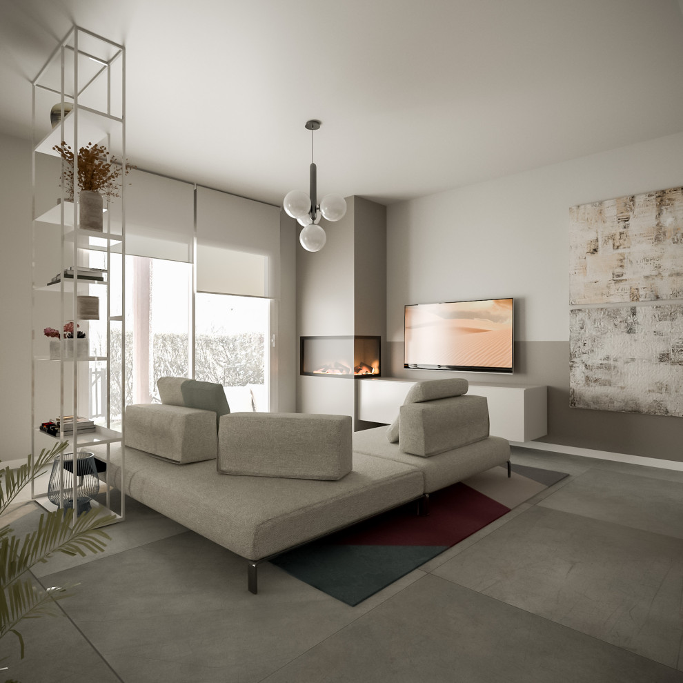Mittelgroßes, Offenes Modernes Wohnzimmer mit grauer Wandfarbe, Tunnelkamin, verputzter Kaminumrandung, TV-Wand und grauem Boden in Mailand