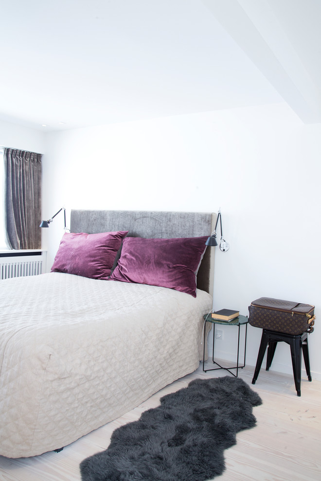 This is an example of a scandi grey and purple bedroom in Copenhagen.
