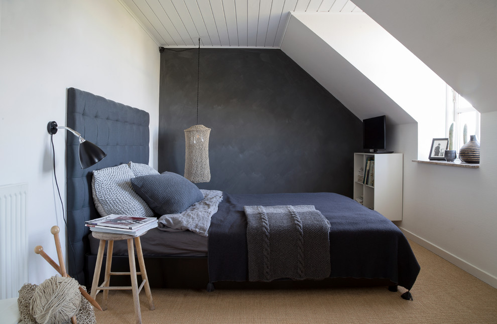 This is an example of a medium sized scandi master bedroom in Copenhagen with white walls, carpet and no fireplace.
