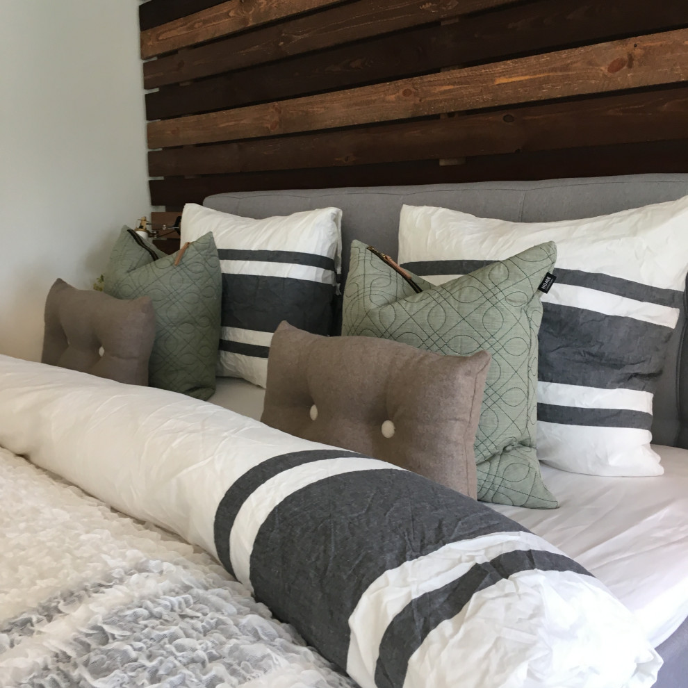 Inspiration for a mid-sized rustic master bedroom remodel in Other with white walls