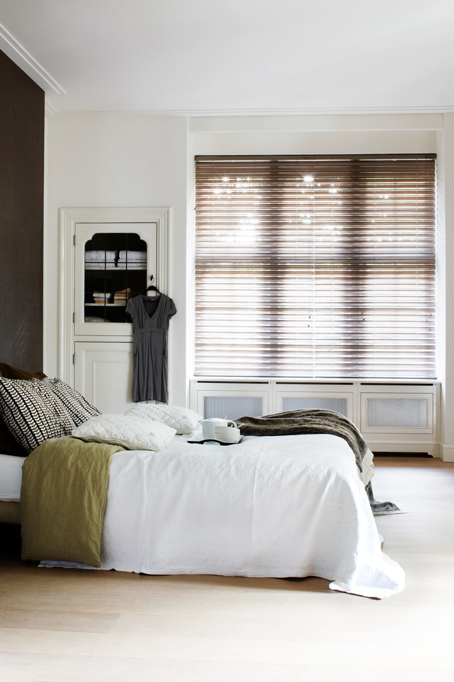 Photo of a medium sized traditional bedroom in Other with black walls.