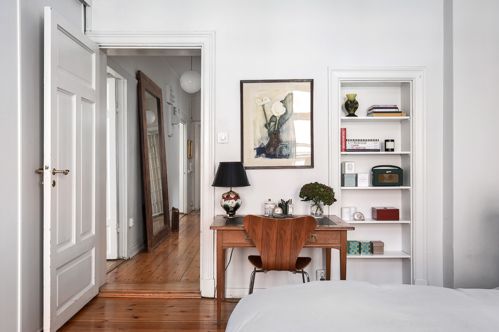 Design ideas for a medium sized scandi master bedroom in Stockholm with grey walls and medium hardwood flooring.