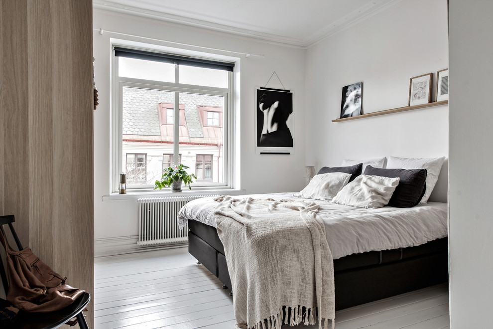 Inspiration for a medium sized scandinavian bedroom in Gothenburg with white walls, painted wood flooring and white floors.