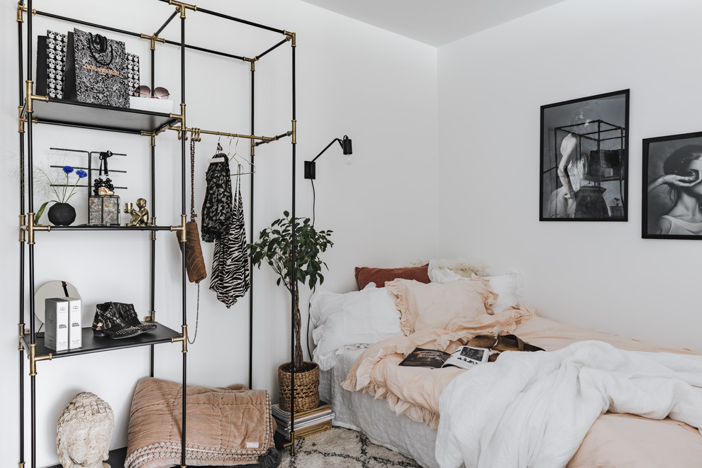 Inspiration for a mid-sized scandinavian guest bedroom remodel in Stockholm with white walls