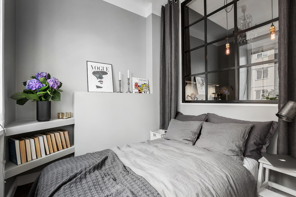 Imagen de habitación de invitados escandinava pequeña sin chimenea con paredes grises