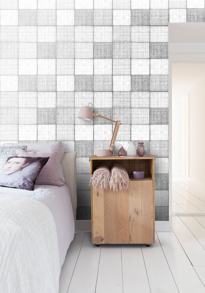 Inspiration för ett nordiskt sovrum, med grå väggar och målat trägolv