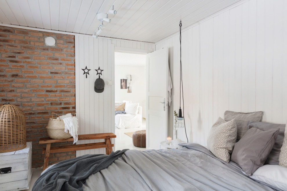 Medium sized scandinavian bedroom in Other with white walls, no fireplace and grey floors.
