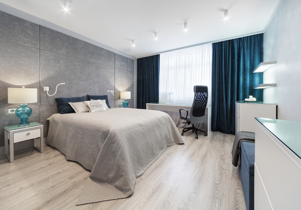 Inspiration for a mid-sized contemporary master laminate floor and brown floor bedroom remodel in Yekaterinburg with gray walls
