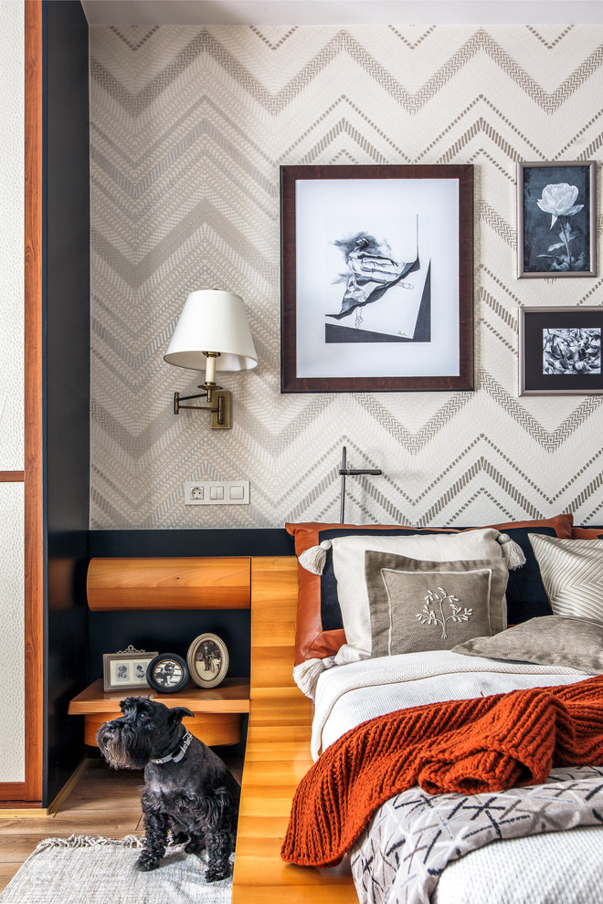 Mid-sized trendy master laminate floor and beige floor bedroom photo in Other with beige walls