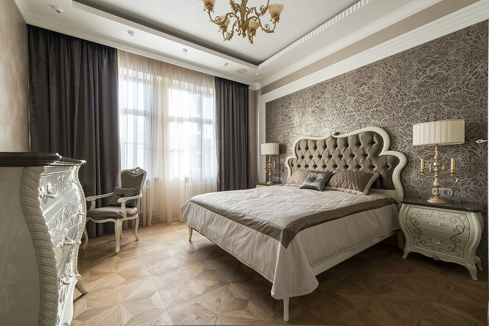 Inspiration for a large traditional master bedroom in Moscow with brown walls, medium hardwood flooring and brown floors.