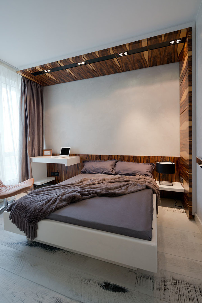 Medium sized contemporary master bedroom in Moscow with white walls and painted wood flooring.