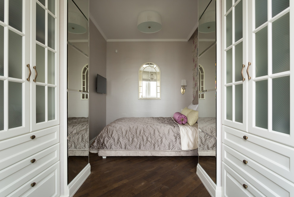Photo of a small traditional master bedroom in Moscow with multi-coloured walls and dark hardwood flooring.