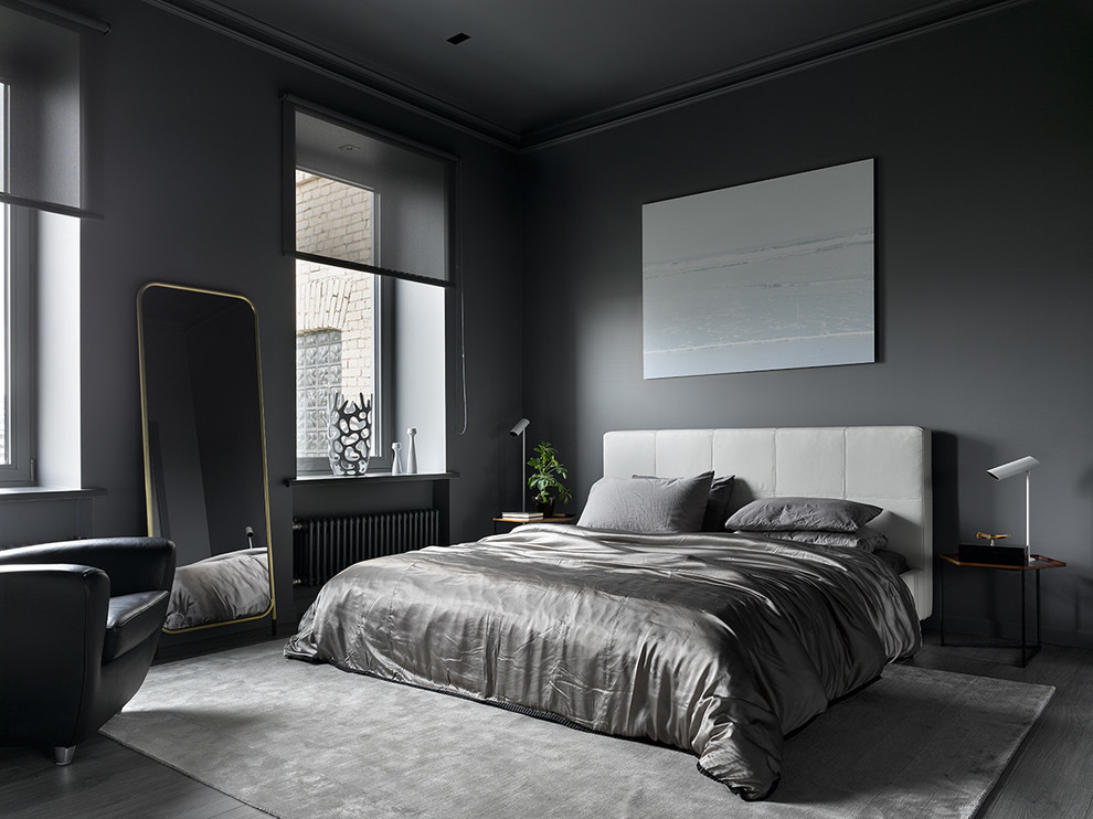 This is an example of a contemporary master and grey and black bedroom in Moscow with grey walls, medium hardwood flooring, grey floors and feature lighting.