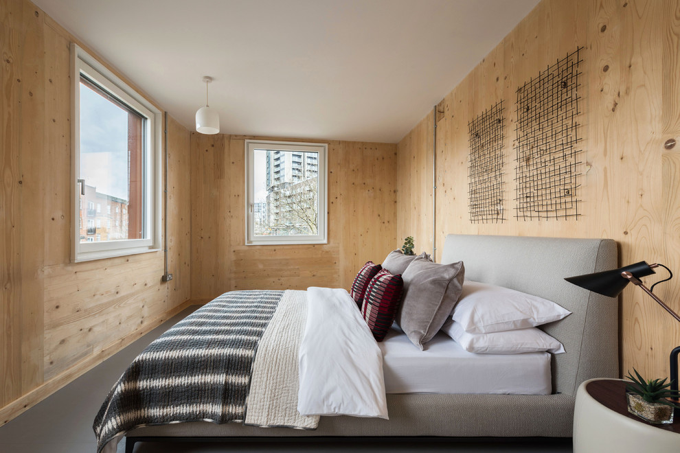 ロンドンにある中くらいな北欧スタイルのおしゃれな客用寝室 (ベージュの壁、グレーの床、リノリウムの床) のレイアウト