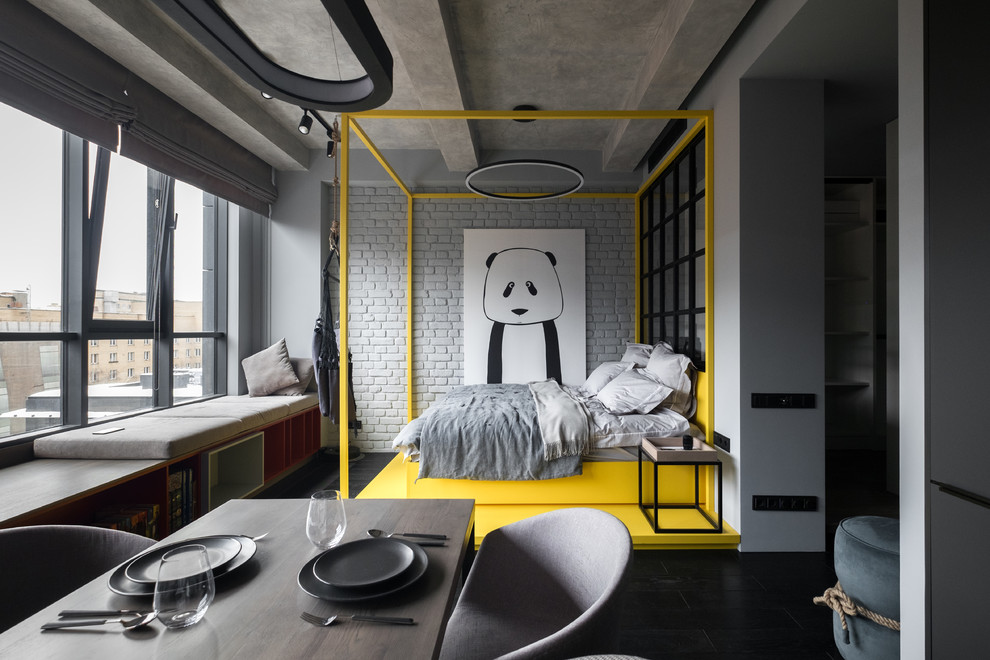 Inspiration for a small contemporary master and grey and yellow bedroom in Moscow with grey walls and black floors.