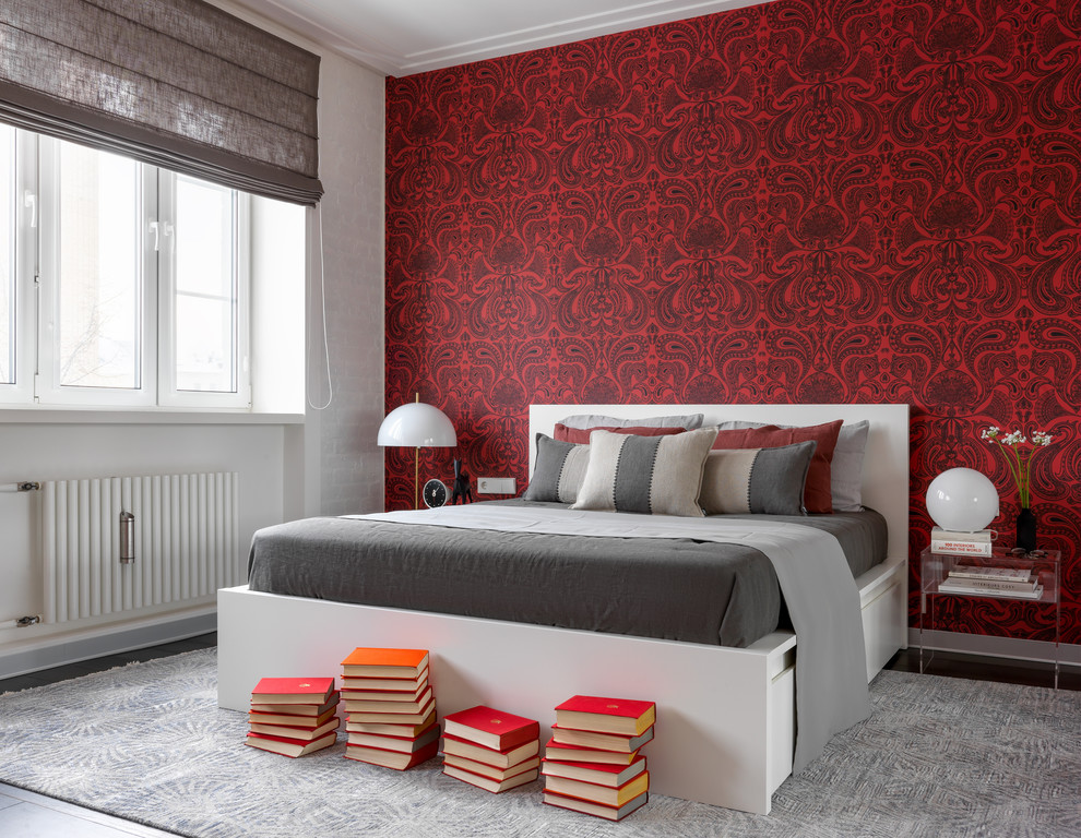Design ideas for a contemporary master bedroom in Moscow with red walls, no fireplace and feature lighting.