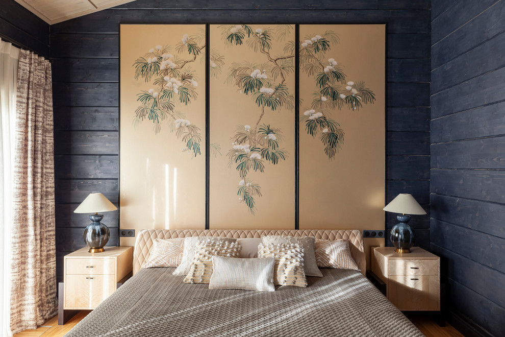 Idées déco pour une chambre d'amis montagne en bois avec un mur bleu, un plafond en lambris de bois et un sol marron.