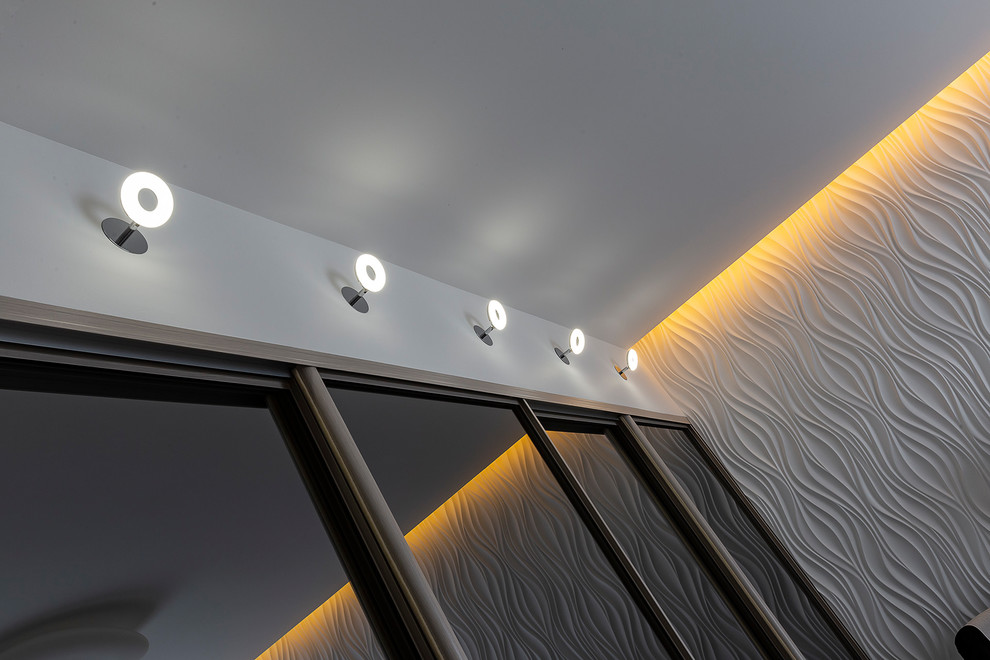Inspiration för mellanstora moderna gästrum, med vita väggar, laminatgolv och grått golv