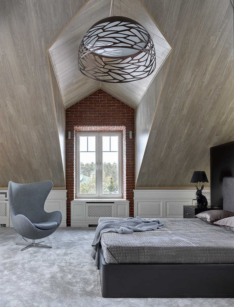 Photo of a contemporary master bedroom in Moscow with carpet and grey floors.