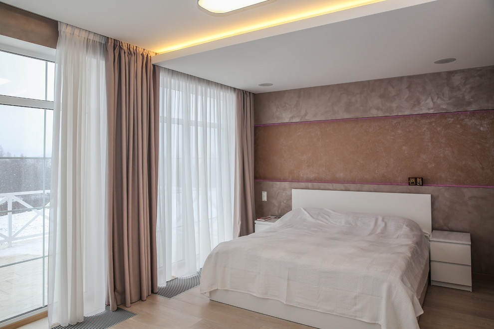 Medium sized scandinavian master bedroom in Moscow with beige walls, medium hardwood flooring and beige floors.