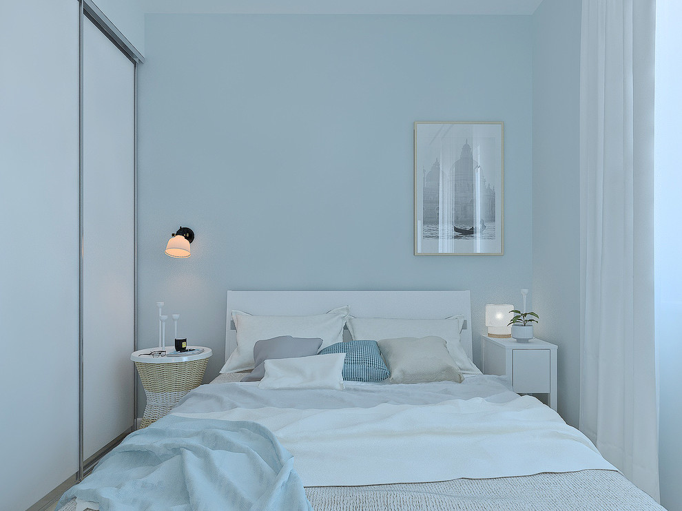 Small scandinavian master bedroom in Other with blue walls and laminate floors.