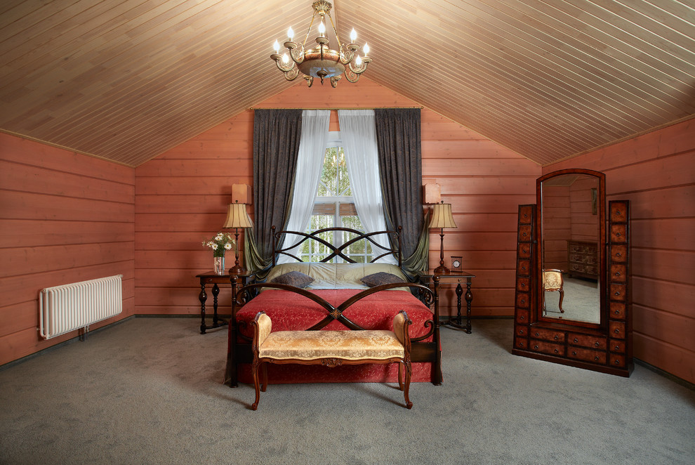 Imagen de dormitorio principal campestre grande con moqueta y paredes rojas
