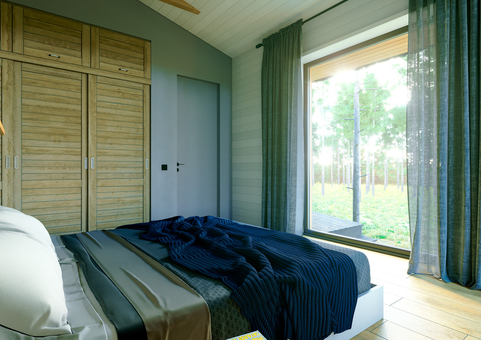 Ejemplo de dormitorio principal nórdico de tamaño medio con paredes azules, suelo de baldosas de porcelana y suelo amarillo