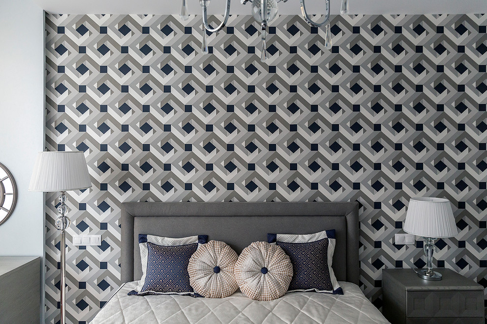 Idée de décoration pour une chambre d'amis design de taille moyenne avec un mur gris, parquet foncé et un sol marron.