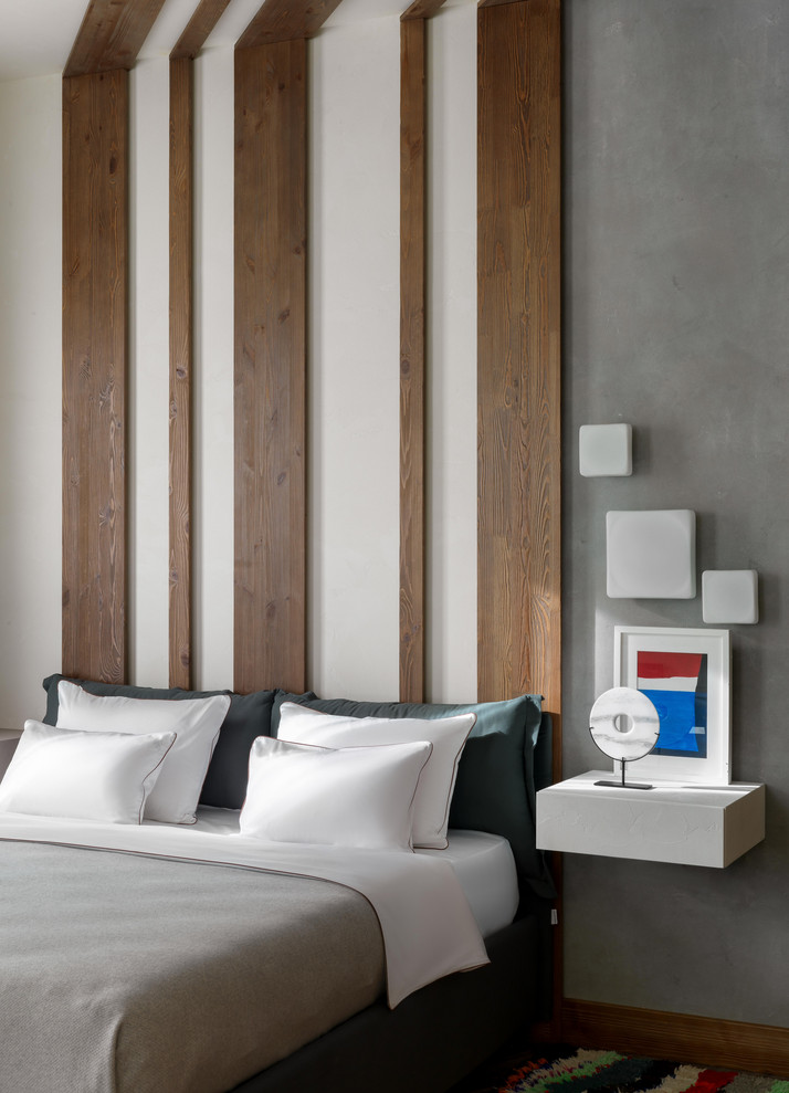 Ejemplo de dormitorio actual con paredes multicolor y madera