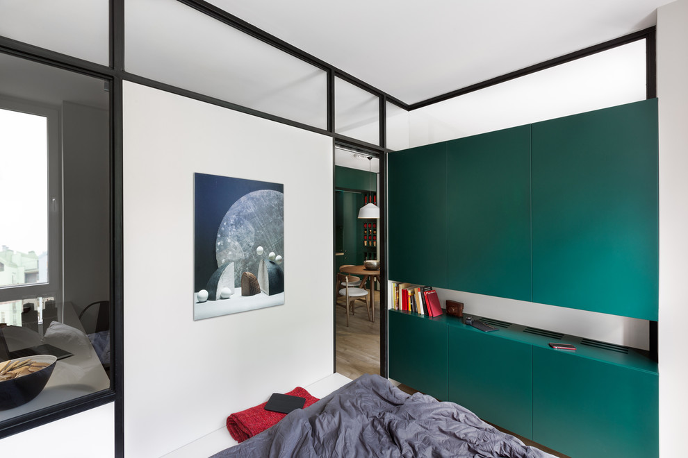 Small contemporary master bedroom in Other with multi-coloured walls.