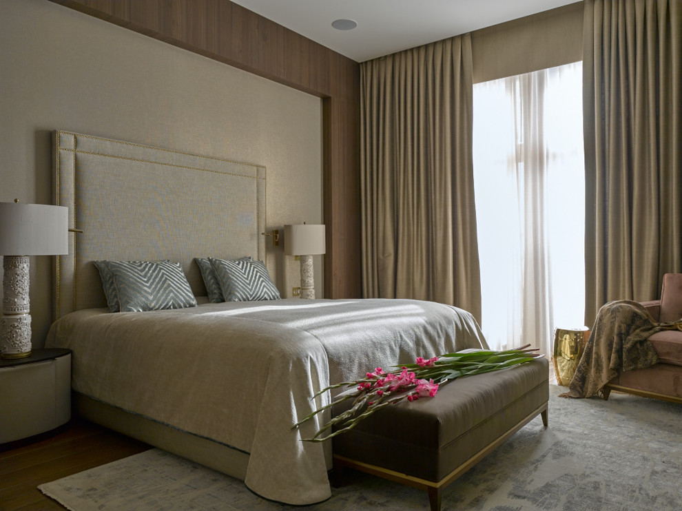Inspiration for a contemporary master bedroom in Moscow with brown walls and carpet.